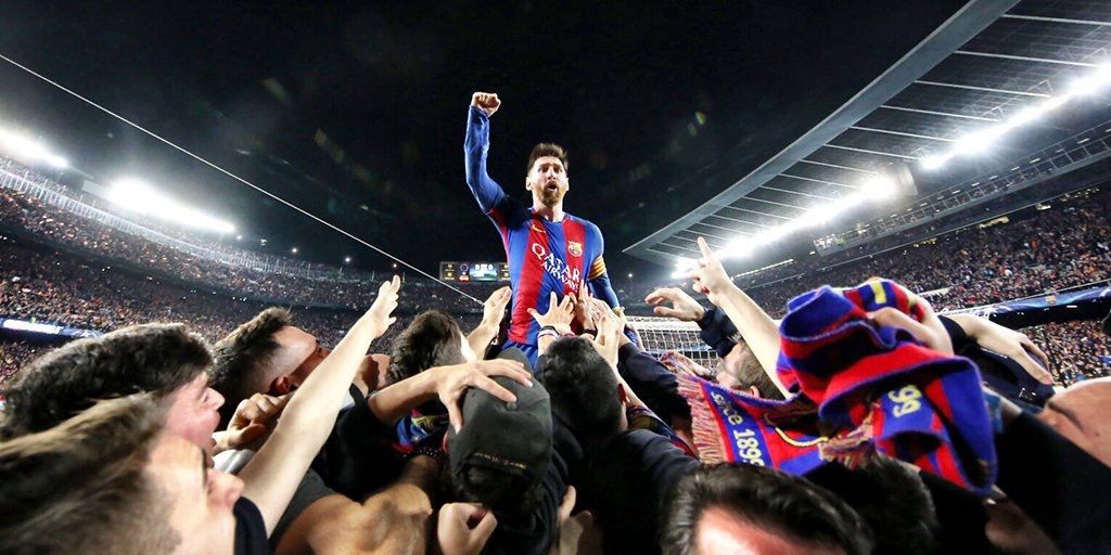 Messi stood on the advertising board with his fist raised in celebration, 2017